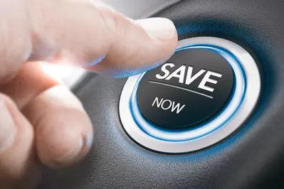man pushing "save now" button